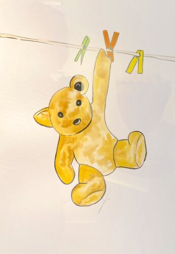 A watercolour painting of a yellow teddy bear hanging by one paw from a washing line with green, orange and yellow pegs. He has black button eyes and nose.