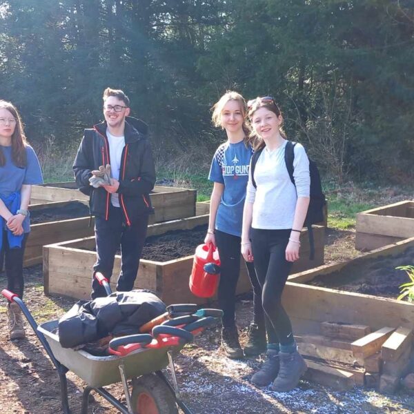 4 young people working in the Kitchen Garden