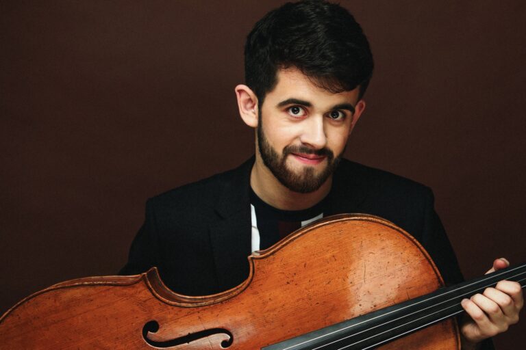 Hugh Mackay holding his cello
