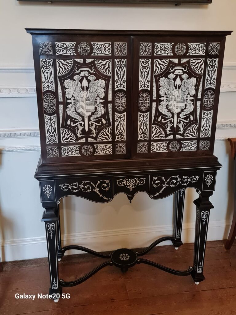 Image of Italian cabinet inlaid with bone. Late 1600s from Italy. On display in the entrance hall at Paxton House