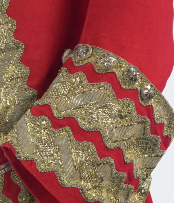 Red coat sleeve close up highlighting gold detailing on the cuffs. Costume collection Paxton House